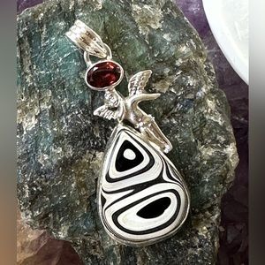 Fordite and garnet Angel sterling silver pendant